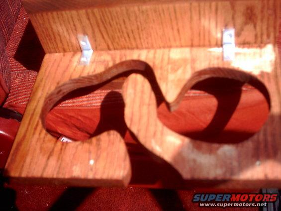 Custom wooden dual cup holder with red fabric visible underneath