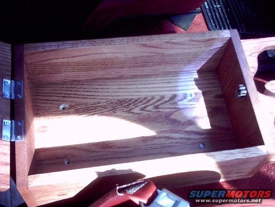 the girl plans to line the inside with a red felt material to match the rest of the interior.  I made it out of clear red oak and finished it with a light red stain.  I plan to tongue oil the whole thing when i have more time and money.