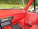1990 Ford Bronco - Interior view of a 1990 Ford Bronco, showing the dashboard and door panel.