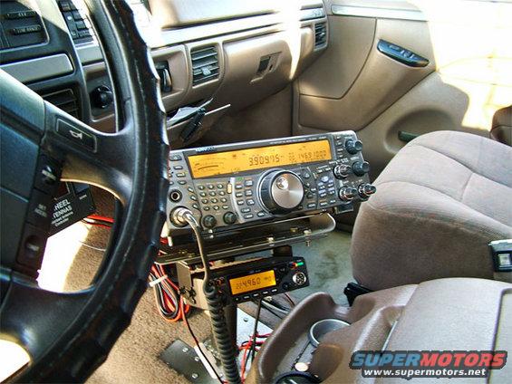 1994 Ford Bronco interior showing dashboard, steering wheel, and two radio units mounted on the center console