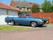 1970 Ford Ranchero - Blue 1970 Ford Ranchero parked in front of a house and garage.