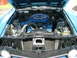 1970 Ford Ranchero - The engine bay of a blue Ford pickup truck, a V8 engine and air cleaner assembly.