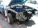 1970 Ford Ranchero - The front end of a blue 1970 Ford Ranchero is disassembled, revealing the engine bay.