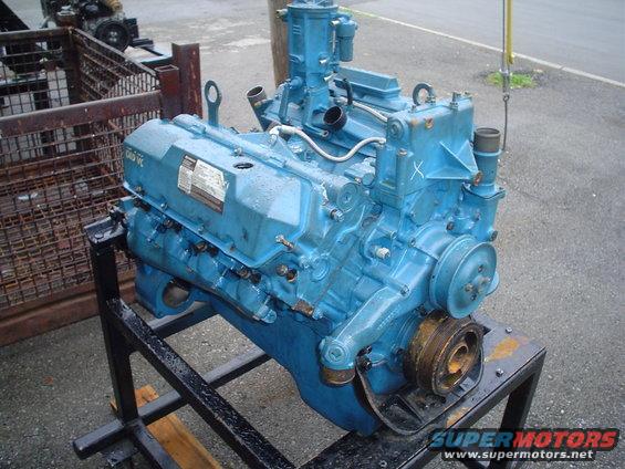 Blue engine on a stand, showing the front and side with a pulley system