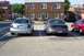 2005 Nissan Altima - Rear view of a silver 2005 Nissan Altima parked in a lot with other vehicles.