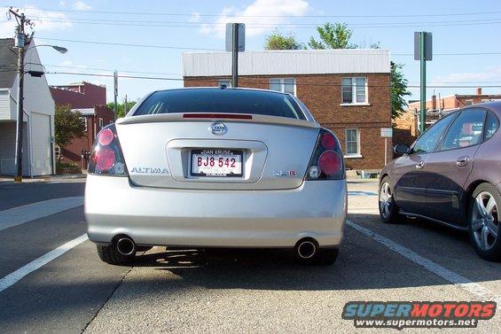 Silver 2005 Nissan Altima rear view, parked, with another car to the right