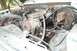 1985 Ford Bronco - Close-up view of an engine bay, showing various mechanical parts and wiring.