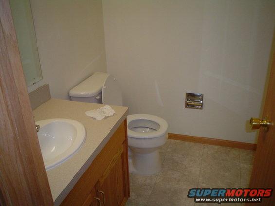 picture-164.jpg 1/2 bath right off the Garage!!!  TP, paper towels and Fast Orange are about all thats in there!!