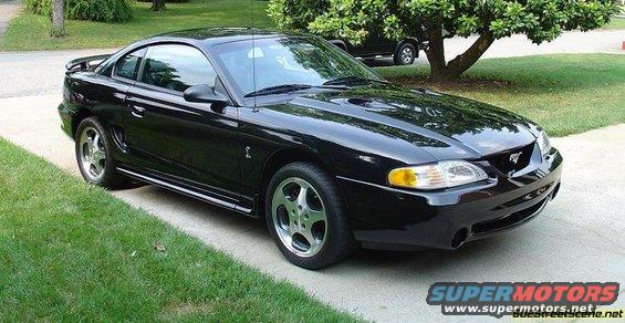 Black 1996 Ford Mustang parked on a driveway