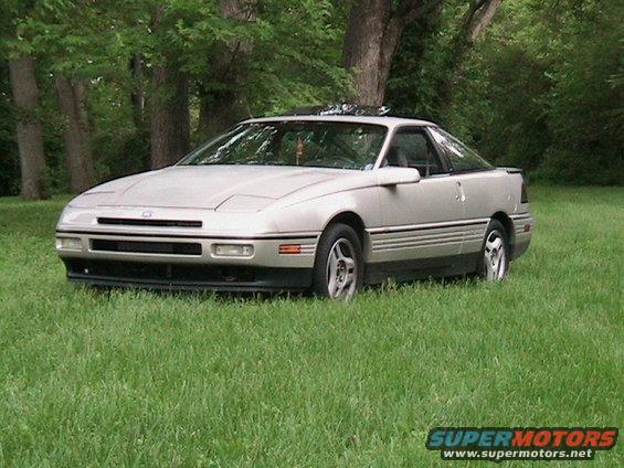 Silver 1989 Ford Probe GT parked in grass, 3/4 front view