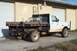 1997 Ford F-350 - This 1997 Ford F-350 pickup truck features a flatbed with a ladder rack and toolboxes.