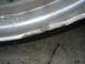 1998 Volkswagen Jetta - A close-up view of a damaged aluminum wheel rim and tire, highlighting the extent of the impact damage.