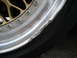 1998 Volkswagen Jetta - Close-up of a severely damaged alloy wheel, showing a bent and scraped rim next to the tire.