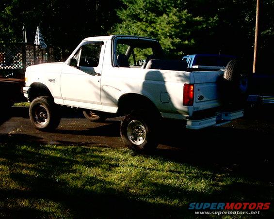 White 1996 Ford Bronco with spare tire mounted on rear