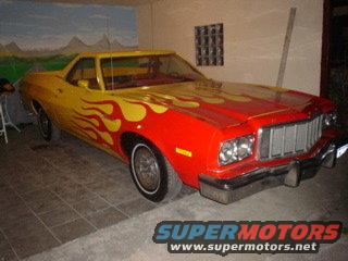 Red and yellow 1974 Ford Ranchero with flame graphics, seen from a 3/4 front angle