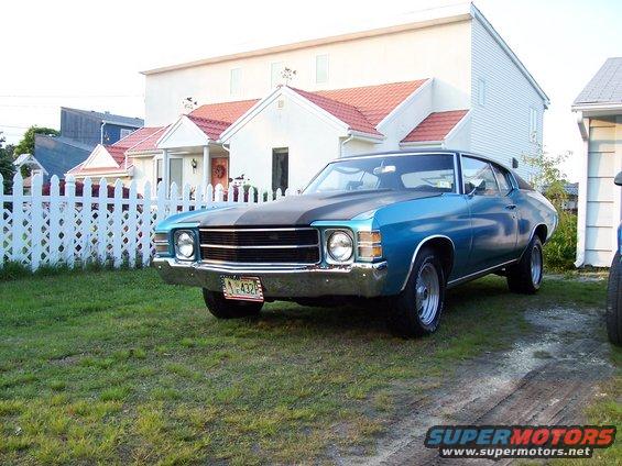 Blue 1970 coupe with black hood stripe and chrome bumper