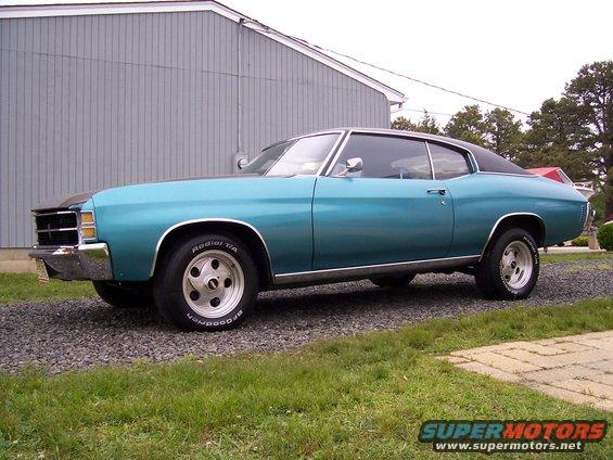 Teal 1971 Chevrolet Chevelle coupe with a black vinyl roof, seen from the side