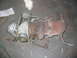 1985 Ford Crown Victoria LTD - Turbocharger assembly shown on a concrete floor, likely removed from a vehicle.