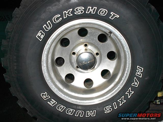 Close-up of a Maxxis Mudder Buckshot tire on a silver 5-lug wheel