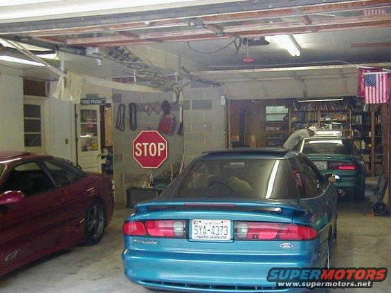 Teal Ford Probe rear view, license plate SYA-4373, with a red Ford Probe to the left