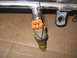 1994 Ford Bronco - A single fuel injector is shown, connected to a fuel rail with wiring.