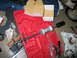 1995 Ford Bronco - A red tool case holds a slide hammer and ball joint separator tool, along with other automotive repair items.