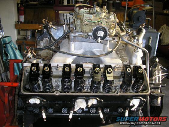 V8 engine block showing valve train and carburetor assembly