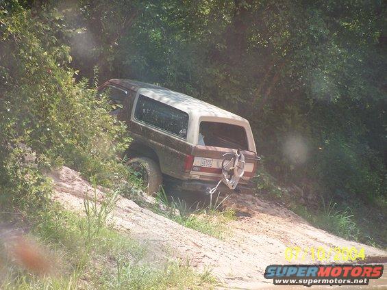 1987 Ford Bronco rear view, brown and white, off-roading