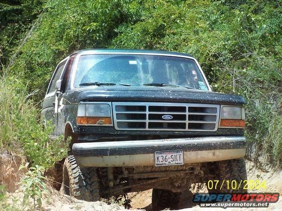 Dark green Ford Bronco with a silver grille and a license plate reading K36-SKT, angled from the front
