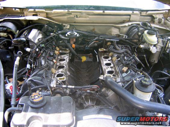 nomanifold.jpg After the stock manifold was removed. Note the different route of the PI coolant tube.