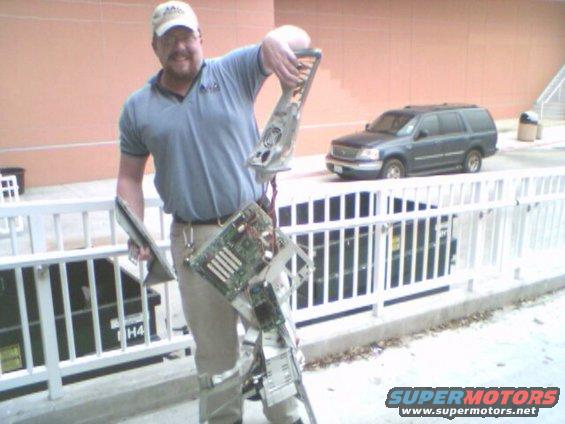 Man holding disassembled computer tower components