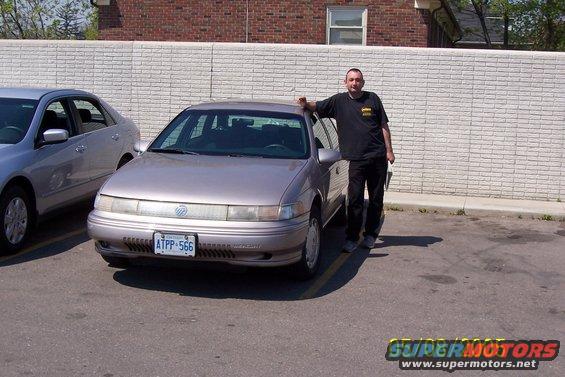 1998 Mercury Sable, silver sedan, front view with man
