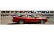 1996 Ford Probe - A red 1996 Ford Probe GT is shown from the side, parked in a dry, outdoor setting with text superimposed on the background.