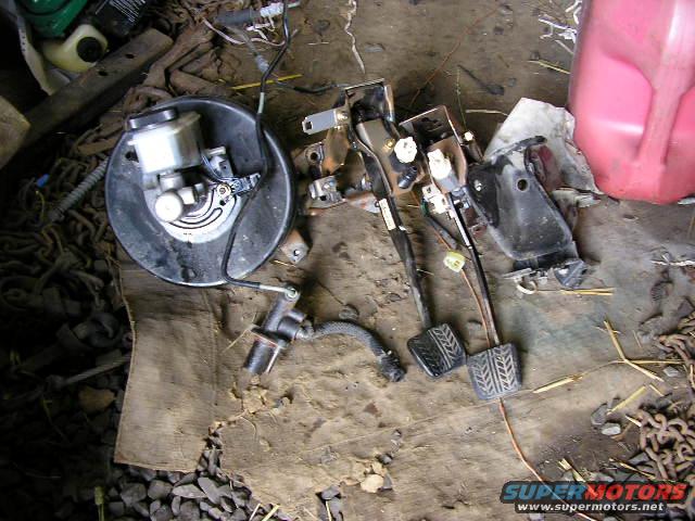 Brake booster and pedal assembly with clutch pedal
