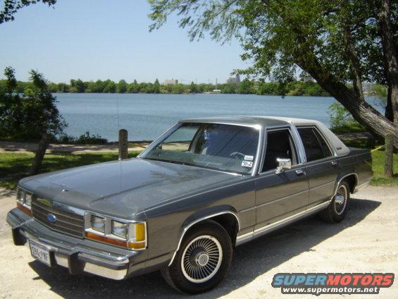 Gray 1988 Ford Crown Victoria LTD parked by a lake