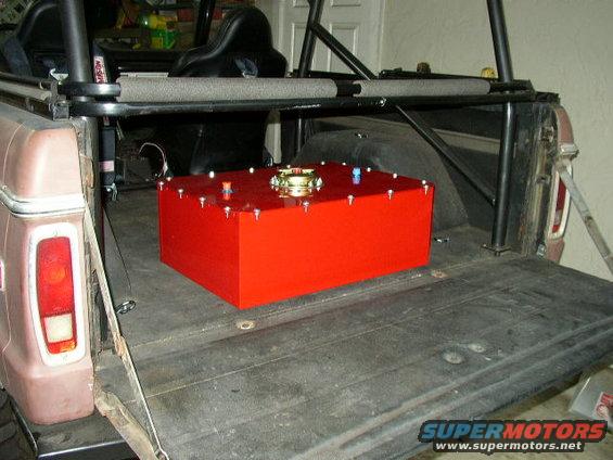 1978 Ford Bronco rear cargo area with a red fuel tank installed