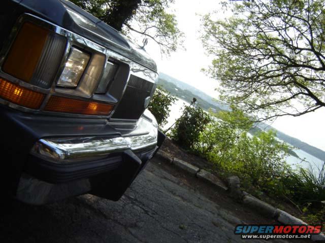 1988 Ford Crown Victoria LTD front end with chrome bumper and grille, angled view
