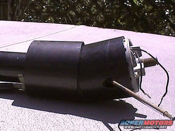 Black steering column part with wires and metal rod
