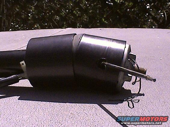 Black steering column assembly with metal rod and wires