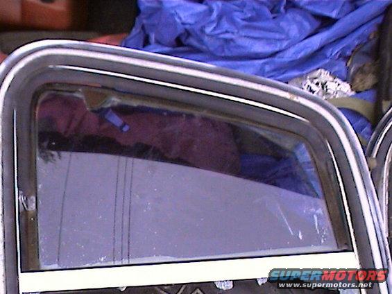 chrome window trim and glass with purple interior reflection