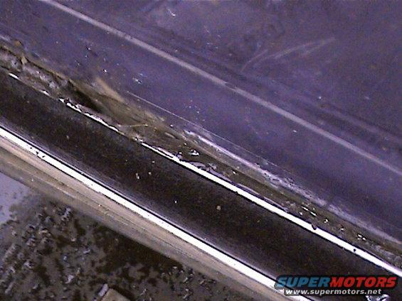 close-up of a dirty, worn door seal on a vehicle