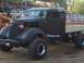 1994 Ford F-150 - Modified vintage truck with "Snap-on" branding and oversized tires sits at an outdoor event.