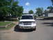 2003 Ford Expedition - A white 2003 Ford Expedition is parked on a dirt road with a blue sky overhead.