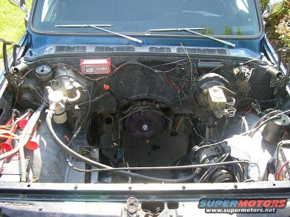 Blue 1979 Chevrolet C/K Pickup engine bay with exposed wiring and components