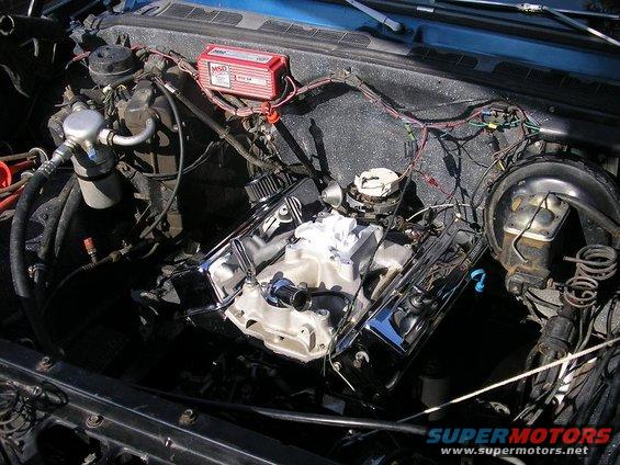 Engine bay with V8 engine, MSD ignition box, and AC components