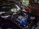 1970 Ford Ranchero - Engine bay of a 1970 Ford Ranchero, a blue Ford V8 engine and chrome air cleaner.