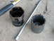 1995 Ford Bronco - Damaged socket and extension bar lying on a concrete surface.