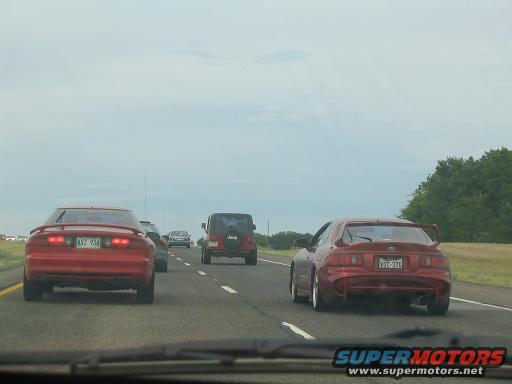 Red 1994 Ford Probe rear view with spoiler and license plate AVZ 934