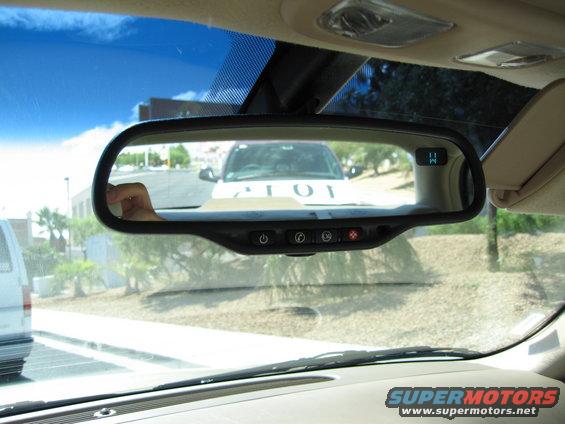 White SUV reflected in rearview mirror, text '101' visible