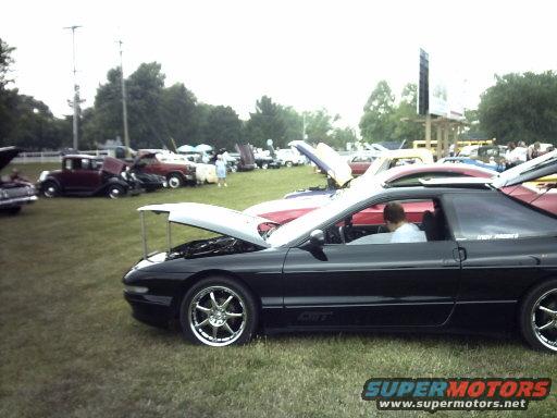 1995 Ford Probe, black, 3/4 front view, hood open, at car show